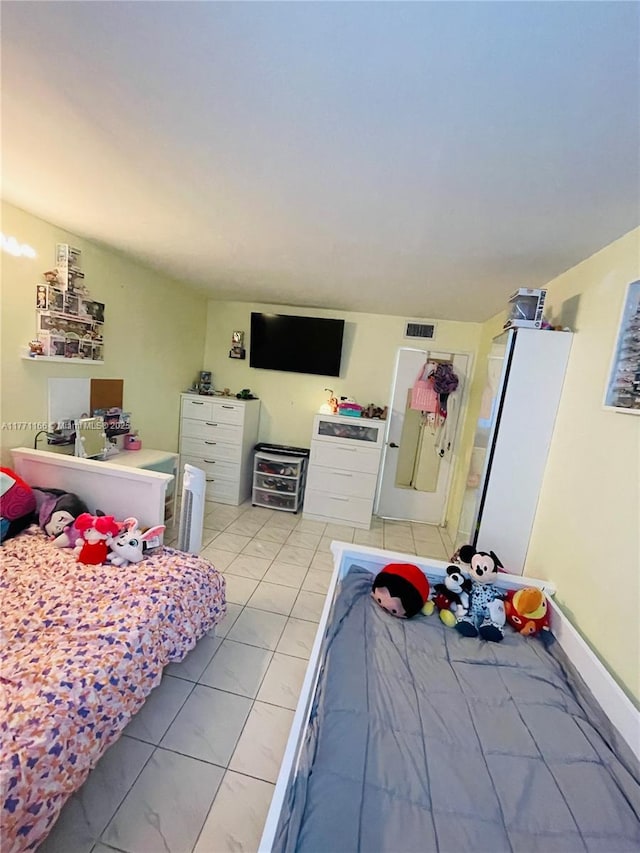 bedroom featuring marble finish floor and visible vents