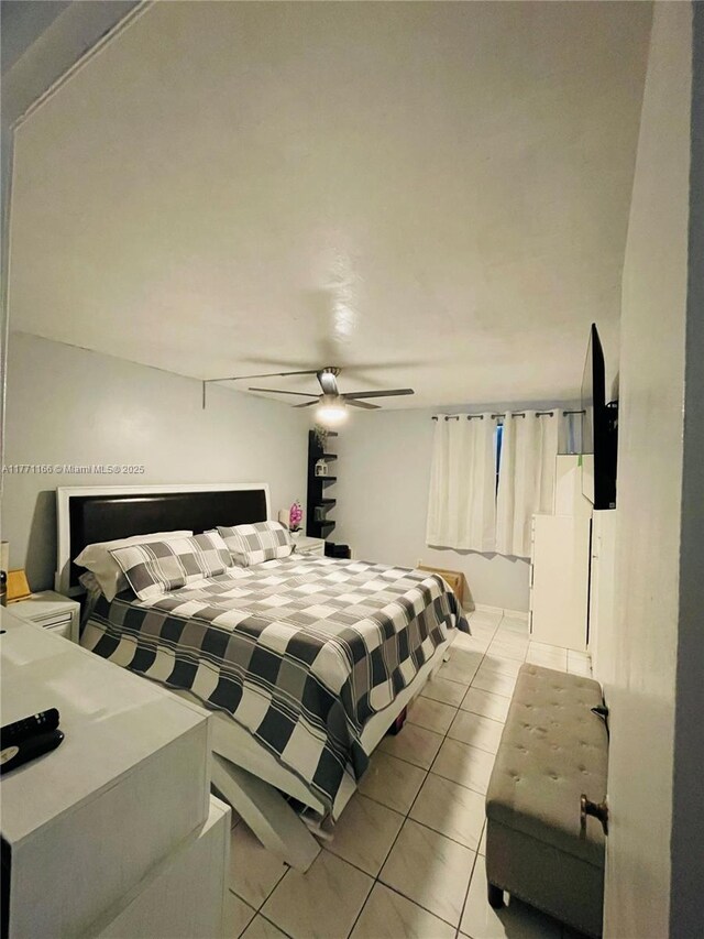 8883 Fontainebleau Blvd Unit 202, Miami, FL 33172 - bedroom featuring light tile patterned flooring and ceiling fan