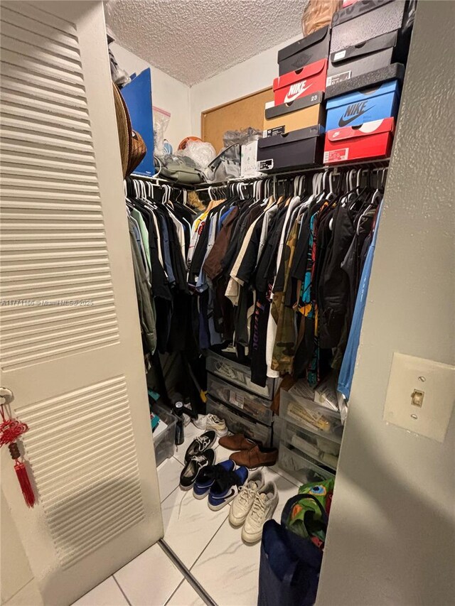 8883 Fontainebleau Blvd Unit 202, Miami, FL 33172 - walk in closet with marble finish floors