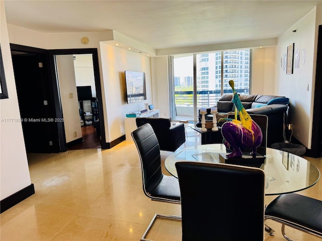 3600 Mystic Pointe Dr Unit 1210, Aventura, FL 33180 - dining space with baseboards