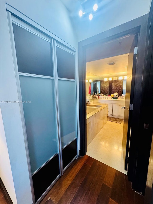 3600 Mystic Pointe Dr Unit 1210, Aventura, FL 33180 - full bath with wood finished floors, a garden tub, and vanity
