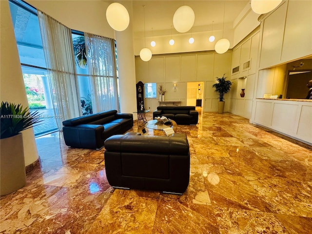 3600 Mystic Pointe Dr Unit 1210, Aventura, FL 33180 - lobby featuring a towering ceiling