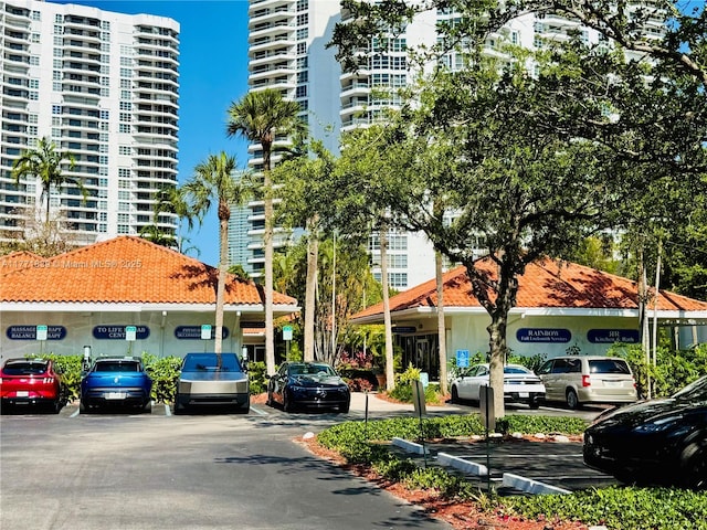 3600 Mystic Pointe Dr Unit 1210, Aventura, FL 33180 - view of apartment building / complex featuring uncovered parking