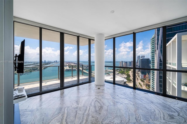 1100 Biscayne Blvd Unit 4901, Miami, FL 33132 - unfurnished room with a wall of windows, a city view, and marble finish flooring