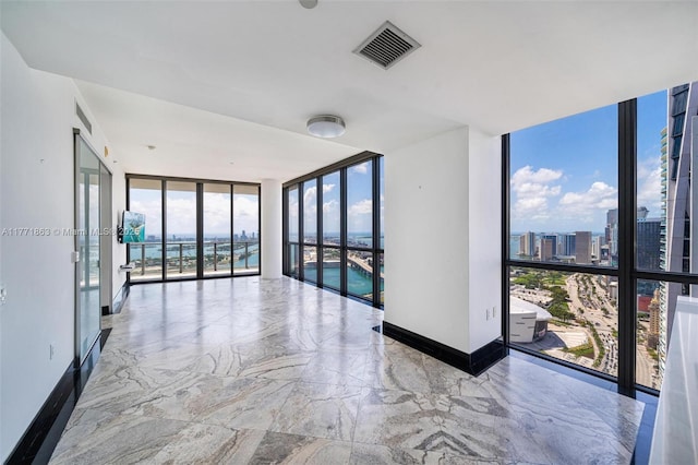 1100 Biscayne Blvd Unit 4901, Miami, FL 33132 - unfurnished room featuring expansive windows and marble tiled flooring