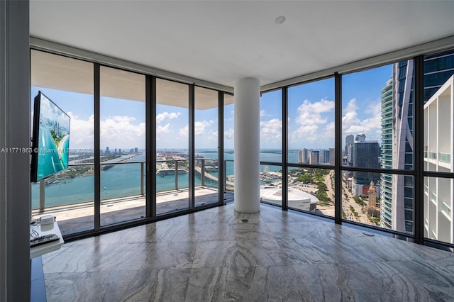 1100 Biscayne Blvd Unit 4901, Miami, FL 33132 - unfurnished room with expansive windows, a city view, plenty of natural light, and marble finish floors