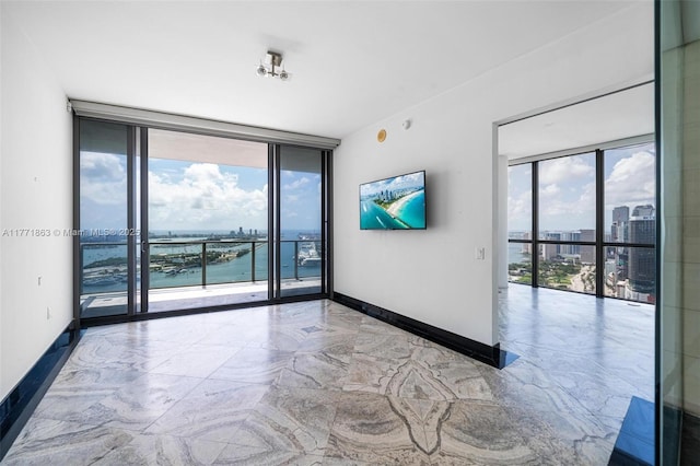 1100 Biscayne Blvd Unit 4901, Miami, FL 33132 - unfurnished room with floor to ceiling windows and marble look tiles