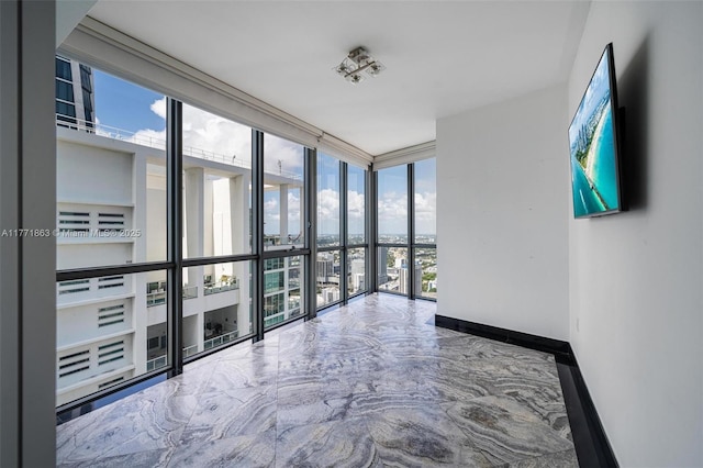 1100 Biscayne Blvd Unit 4901, Miami, FL 33132 - unfurnished room featuring a wall of windows and marble tiled floors