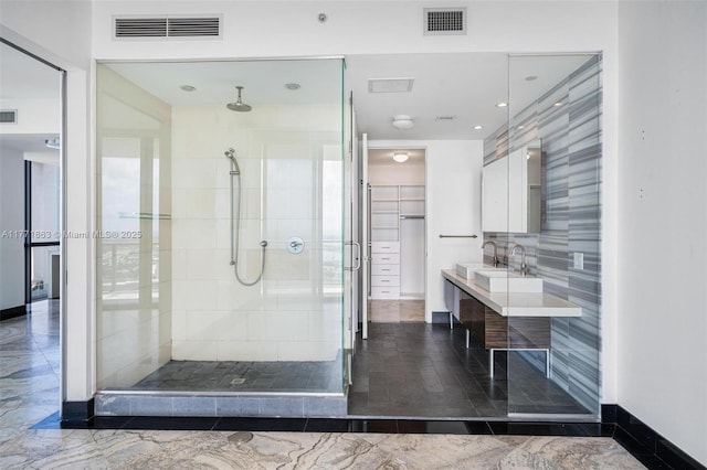 1100 Biscayne Blvd Unit 4901, Miami, FL 33132 - full bathroom featuring a stall shower, vanity, a spacious closet, and recessed lighting