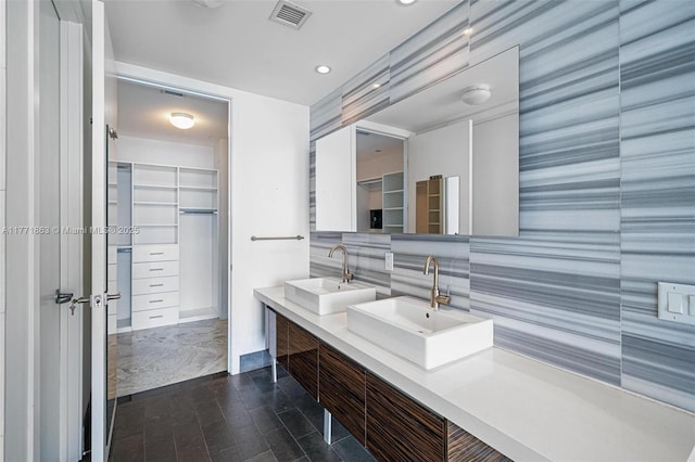 1100 Biscayne Blvd Unit 4901, Miami, FL 33132 - bathroom featuring an accent wall, double vanity, a walk in closet, recessed lighting, and wallpapered walls