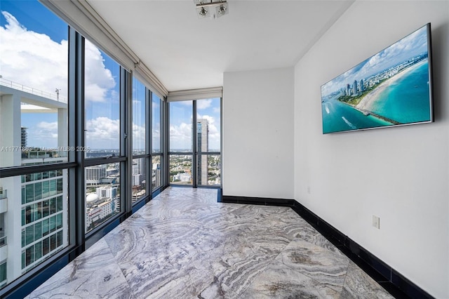1100 Biscayne Blvd Unit 4901, Miami, FL 33132 - unfurnished room with expansive windows and baseboards