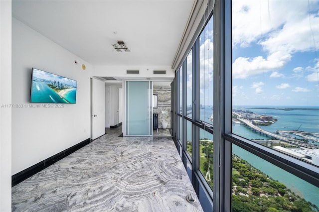 1100 Biscayne Blvd Unit 4901, Miami, FL 33132 - unfurnished bedroom featuring a water view, marble finish floors, and expansive windows