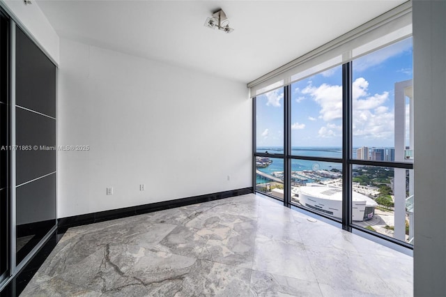 1100 Biscayne Blvd Unit 4901, Miami, FL 33132 - spare room with a water view, floor to ceiling windows, healthy amount of natural light, and a city view