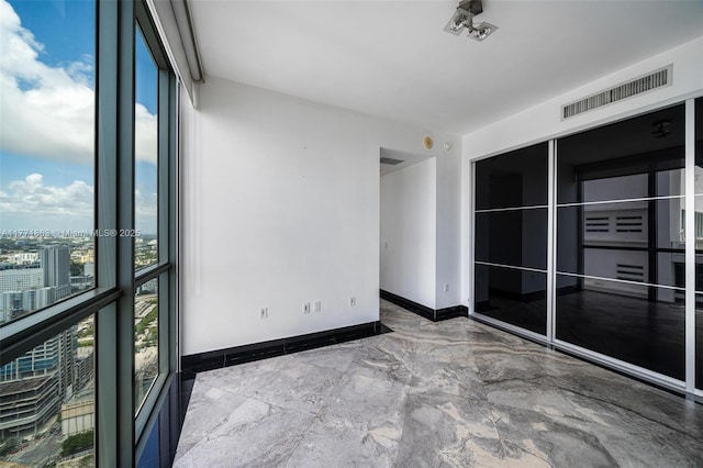 1100 Biscayne Blvd Unit 4901, Miami, FL 33132 - unfurnished room with marble tiled flooring and floor to ceiling windows