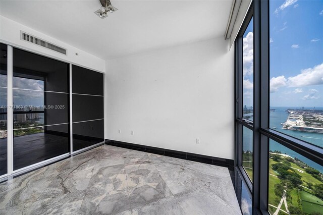 1100 Biscayne Blvd Unit 4901, Miami, FL 33132 - unfurnished sunroom featuring a water view and plenty of natural light