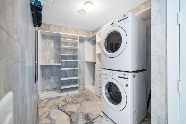 1100 Biscayne Blvd Unit 4901, Miami, FL 33132 - washroom with stacked washer / drying machine and marble finish floors