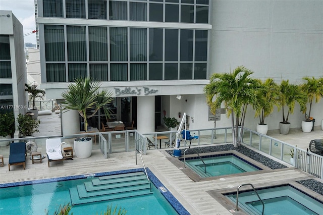 1100 Biscayne Blvd Unit 4901, Miami, FL 33132 - community pool with a community hot tub and a patio area