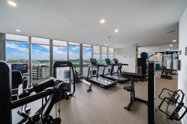 1100 Biscayne Blvd Unit 4901, Miami, FL 33132 - workout area featuring plenty of natural light, a water view, recessed lighting, and a wall of windows