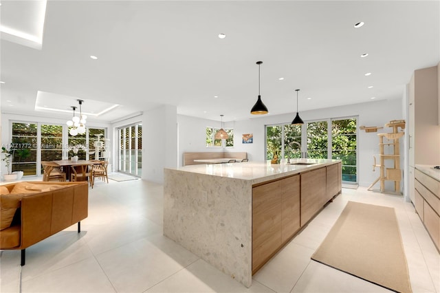 kitchen with modern cabinets, a spacious island, and recessed lighting