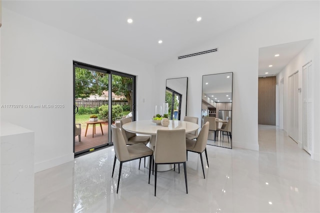 475 NW 87th St, El Portal, FL 33150 - dining room with recessed lighting, baseboards, vaulted ceiling, and light tile patterned floors