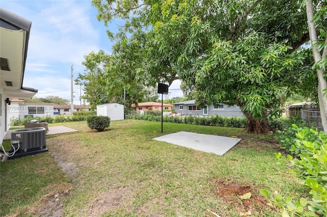 475 NW 87th St, El Portal, FL 33150 - view of yard featuring central AC unit, a storage shed, an outdoor structure, and a patio