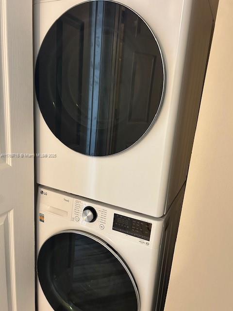 3001 NE 185th St Unit 418, Aventura, FL 33180 - washroom with stacked washing machine and dryer