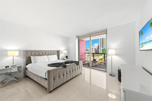 2600 E Hallandale Beach Blvd Unit T1001, Hallandale Beach, FL 33009 - bedroom with access to exterior, light tile patterned flooring, floor to ceiling windows, and baseboards