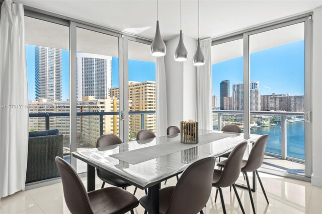 2600 E Hallandale Beach Blvd Unit T1001, Hallandale Beach, FL 33009 - dining room with floor to ceiling windows, a view of skyline, plenty of natural light, and light tile patterned floors