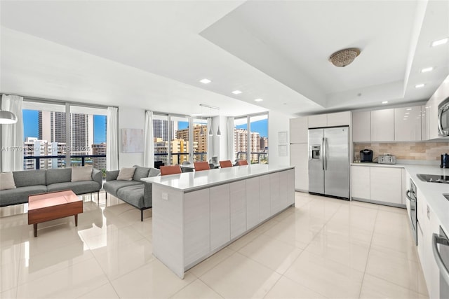 2600 E Hallandale Beach Blvd Unit T1001, Hallandale Beach, FL 33009 - kitchen with appliances with stainless steel finishes, modern cabinets, a view of city, light tile patterned floors, and recessed lighting