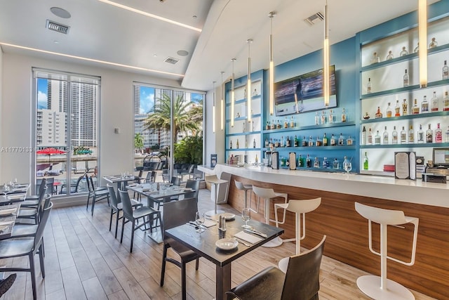 2600 E Hallandale Beach Blvd Unit T1001, Hallandale Beach, FL 33009 - dining space featuring a community bar and wood finished floors