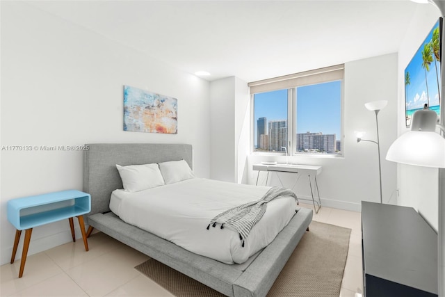 2600 E Hallandale Beach Blvd Unit T1001, Hallandale Beach, FL 33009 - bedroom with light tile patterned floors, baseboards, and a city view