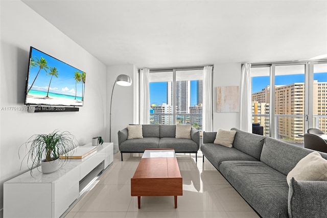 2600 E Hallandale Beach Blvd Unit T1001, Hallandale Beach, FL 33009 - living area featuring light tile patterned flooring, expansive windows, and healthy amount of natural light