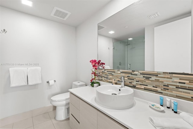 2600 E Hallandale Beach Blvd Unit T1001, Hallandale Beach, FL 33009 - full bath with tasteful backsplash, a stall shower, tile patterned flooring, toilet, and vanity