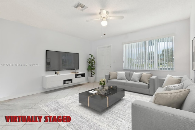 4499 NW 18th Ave, Oakland Park, FL 33309 - tiled living area with a ceiling fan and baseboards