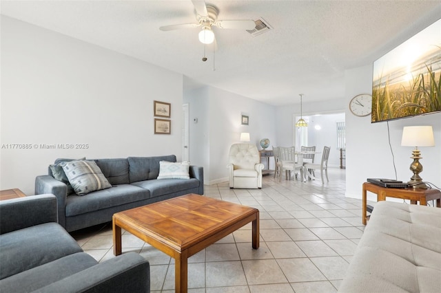 4499 NW 18th Ave, Oakland Park, FL 33309 - living area featuring ceiling fan, light tile patterned floors, and baseboards