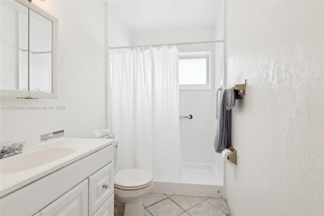 4499 NW 18th Ave, Oakland Park, FL 33309 - bathroom featuring a stall shower, tile patterned floors, toilet, and vanity