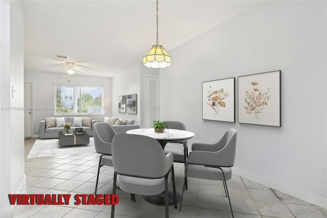 4499 NW 18th Ave, Oakland Park, FL 33309 - dining space featuring a ceiling fan, light tile patterned floors, and baseboards