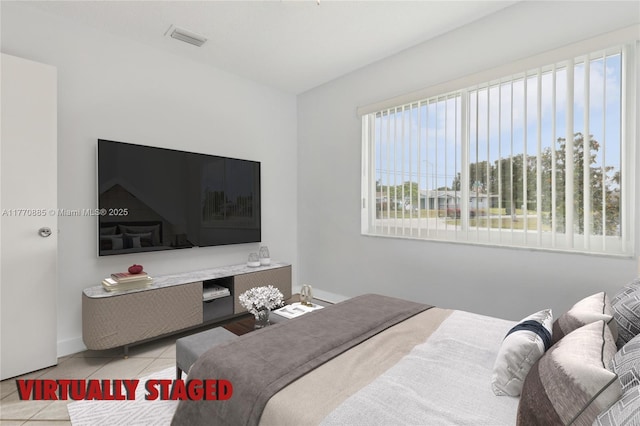 4499 NW 18th Ave, Oakland Park, FL 33309 - bedroom with tile patterned flooring and baseboards