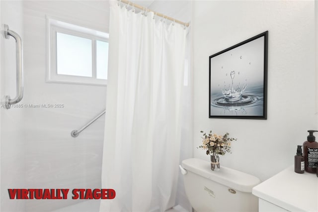 4499 NW 18th Ave, Oakland Park, FL 33309 - bathroom with a shower with curtain and toilet