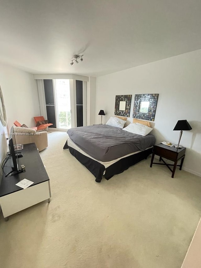 9595 Collins Ave Unit N5-J, Surfside, FL 33154 - bedroom with light carpet and rail lighting