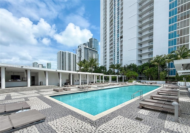 pool with a patio and a view of city