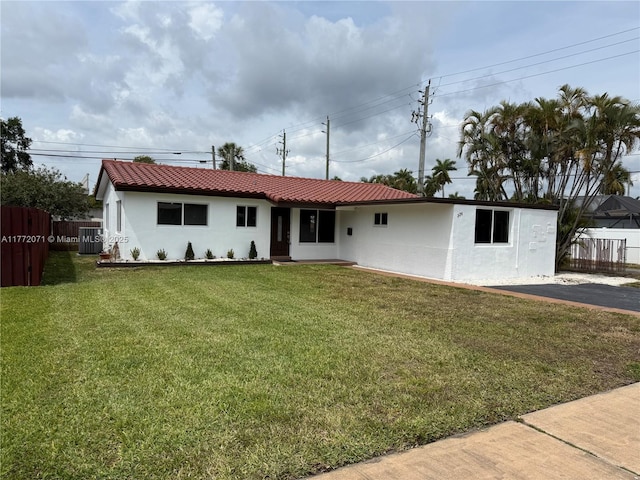 326 N 32nd Ave, Hollywood, FL 33021 - ranch-style home with stucco siding, central air condition unit, and a tiled roof