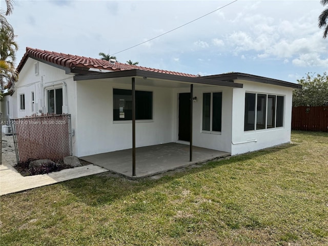 326 N 32nd Ave, Hollywood, FL 33021 - rear view of house with a patio, a tiled roof, and stucco siding