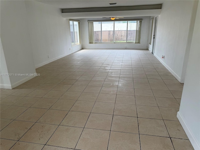 326 N 32nd Ave, Hollywood, FL 33021 - empty room featuring light tile patterned flooring, a ceiling fan, and baseboards