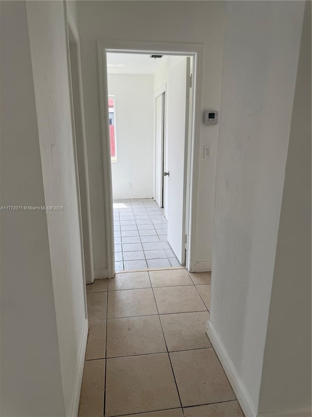 326 N 32nd Ave, Hollywood, FL 33021 - hallway featuring baseboards and light tile patterned floors