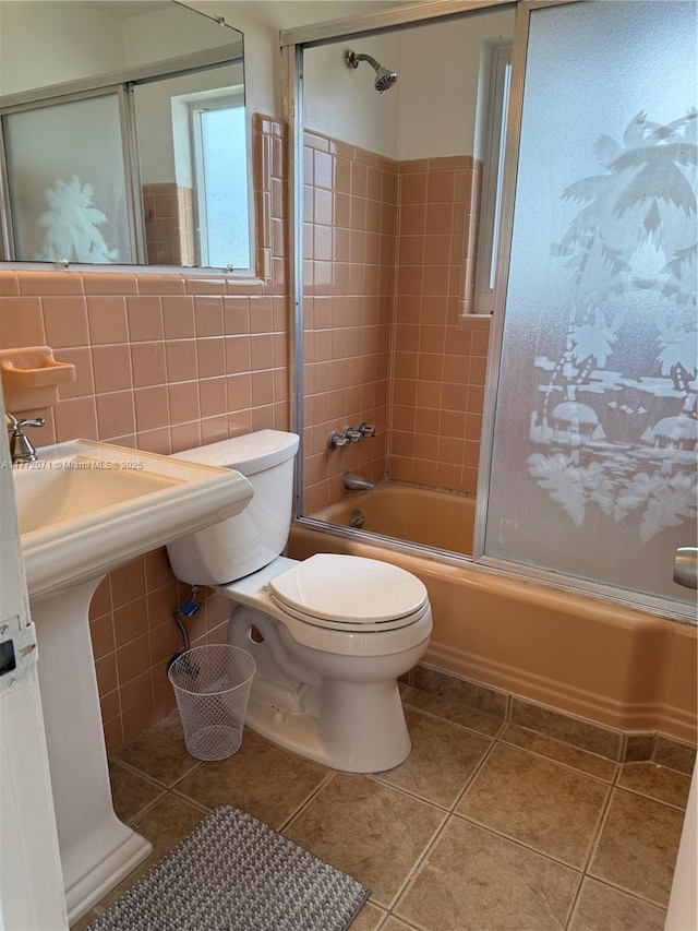 326 N 32nd Ave, Hollywood, FL 33021 - full bath with toilet, tile walls, tile patterned flooring, and combined bath / shower with glass door