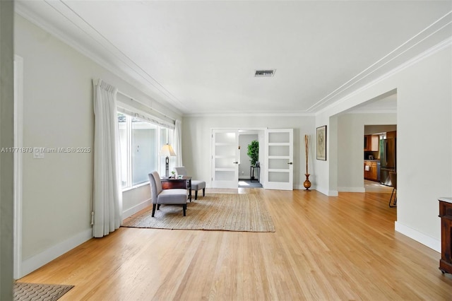 1259 NE 98th St, Miami Shores, FL 33138 - sitting room with ornamental molding, visible vents, built in features, and light wood-type flooring