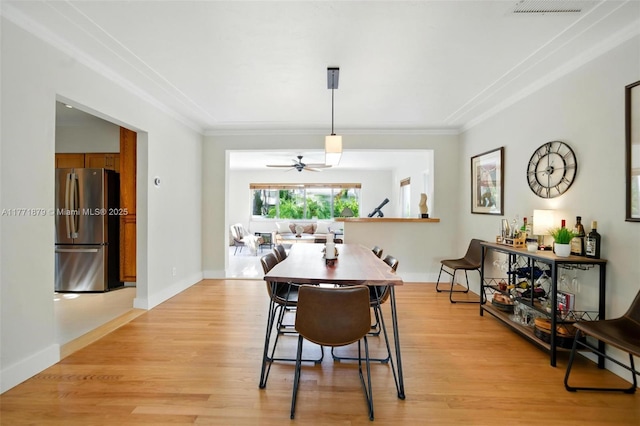 1259 NE 98th St, Miami Shores, FL 33138 - dining space featuring light wood-style floors, ceiling fan, baseboards, and ornamental molding