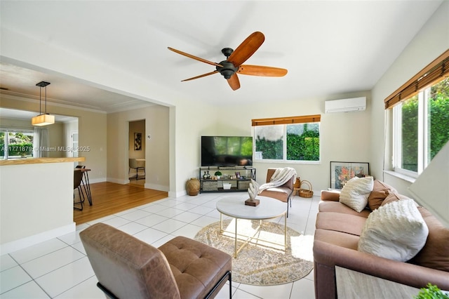 1259 NE 98th St, Miami Shores, FL 33138 - living room with a wall unit AC, light tile patterned flooring, ceiling fan, and a healthy amount of sunlight