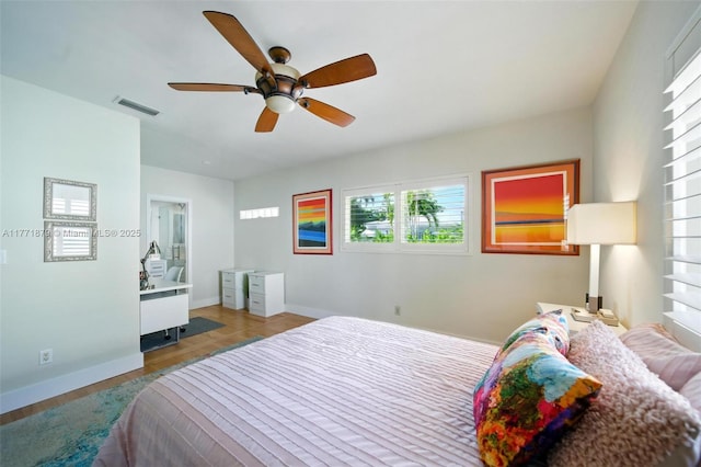 1259 NE 98th St, Miami Shores, FL 33138 - bedroom with visible vents, multiple windows, baseboards, and wood finished floors